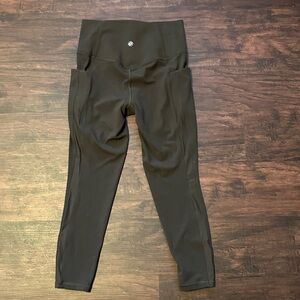 Athleta salutation stash mesh 7/8 tight. Brownish-ish in color.